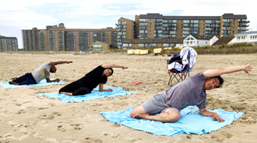 yoga with friends on the beach